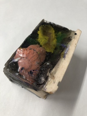 untitled [book sculpture with pink and yellow flowers] / Stella Waitzkin